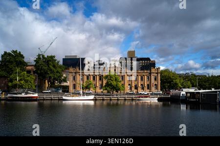 Scenic Waterfront View of the Historic Customs House Building and Moored Boats at Constitution Dock in Hobart Stock Photo