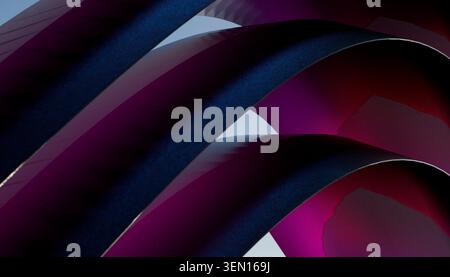 Vibrant abstract design with curved blue and purple geometric shapes. Stock Photo