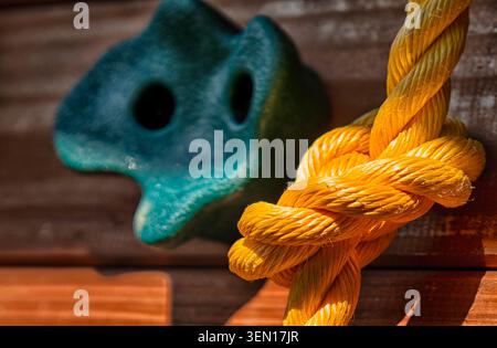 Yellow polypropylene rope with a complex knot Stock Photo