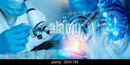 Close-up of scientists using a microscope, pipette, and test tube with holographic medical icons, illustrating laboratory diagnostics, biotech innovat Stock Photo
