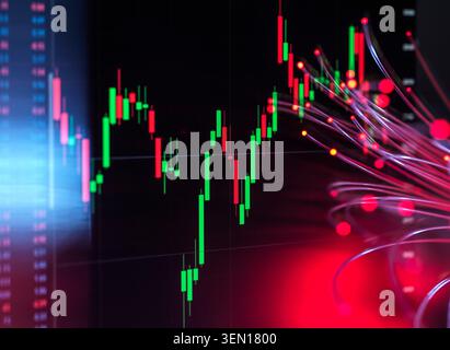 Financial chart with dynamic red and green candlestick patterns and abstract light streaks. Stock Photo