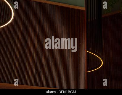 Dramatic ceiling lighting reflected onto a dark marble surface Stock Photo