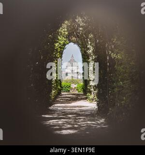 Keyhole view of St Peter's Basilica through the Knights of Malta gate in Rome, Italy Stock Photo