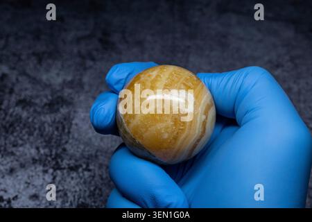 Glossy brown polished round natural stone, close-up Stock Photo