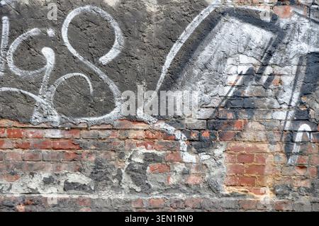 Graffiti on house wall with bricks Stock Photo