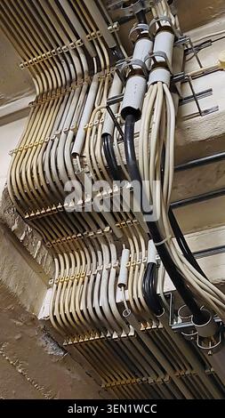 Angled, surface-mounted electrical installation with empty conduits and cable terminals Stock Photo