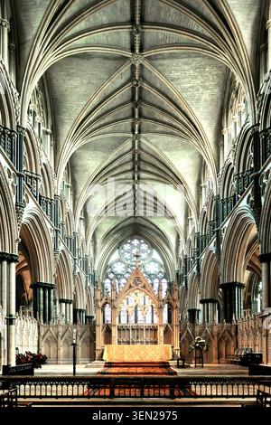 Interior of Lincoln Cathedral, Minster Yard, Lincoln - Sanctuary of St Hugh's Choir looking east, showing stone high altar set before a canopied altar Stock Photo