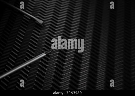 Close up of screwdriver tip on dark textured background. Concept of precision work, repair, maintenance and tools with copy space. Stock Photo