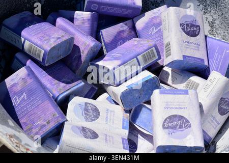 Stack of lavender-themed handmade soap packages displayed together, highlighting natural skincare products inspired by aromatic lavender fields and bo Stock Photo