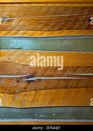 Abstract Log Cabin Inside Wall with Chinking and Saw Marks Stock Photo