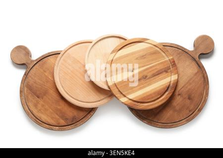 Assorted round wooden pizza boards and serving platters for kitchen and restaurant use, isolated on white background Stock Photo