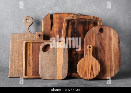 Assortment of rustic wooden cutting boards and serving platters for kitchen and food preparation Stock Photo