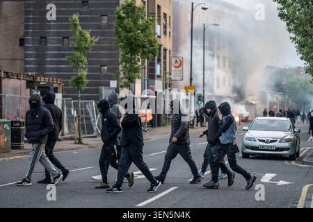 Belfast, UK. 09th June, 2026. Belfast youths burn down a grocery store owned by an immigrant. Belfast erupted into flames as locals took to the streets to protest against the stabbing of a North Belfast man by a Sudanese national refugee. Road blockades were set up all over Belfast bringing much of the city to a standstill. The protestors are demanding a stop to immigration into Northern Ireland. Credit: SOPA Images Limited/Alamy Live News Stock Photo