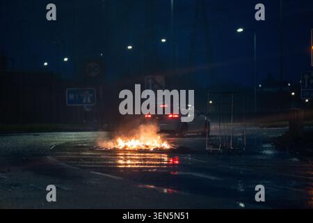 Belfast, UK. 09th June, 2026. One of very many fires blockading a road in Belfast. Belfast erupted into flames as locals took to the streets to protest against the stabbing of a North Belfast man by a Sudanese national refugee. Road blockades were set up all over Belfast bringing much of the city to a standstill. The protestors are demanding a stop to immigration into Northern Ireland. Credit: SOPA Images Limited/Alamy Live News Stock Photo