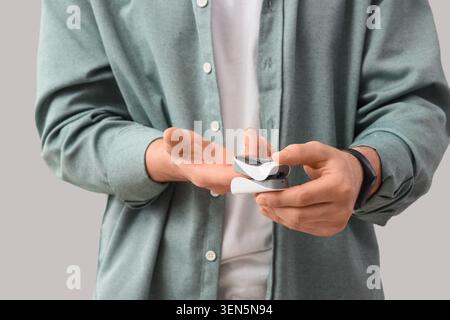 Man using pulse oximeter for oxygen saturation and heart rate monitoring, health care and medical device Stock Photo