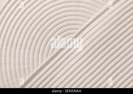 Zen garden sand texture with raked curved and straight lines for relaxation and meditation background Stock Photo