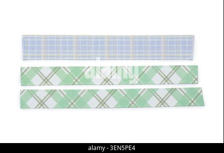 Three plaid patterned washi tapes blue and green argyle designs crafting and decorative supplies isolated on white background Stock Photo