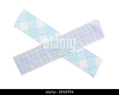 Two plaid fabric strips with blue and yellow patterns intersecting on a clean white background, the textile materials feature a geometric design of sq Stock Photo