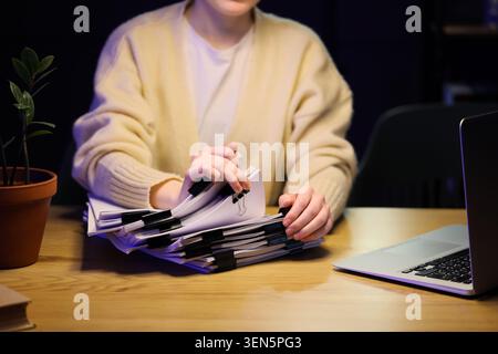 Office organization and administration, businesswoman arranging folders ...