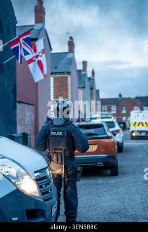 Belfast, UK. 09th June, 2026. Riot Police arrive at the scene of a fire lit by protestors in Belfast. Belfast erupted into flames as locals took to the streets to protest against the stabbing of a North Belfast man by a Sudanese national refugee. Road blockades were set up all over Belfast bringing much of the city to a standstill. The protestors are demanding a stop to immigration into Northern Ireland. (Photo by Lab Mo/SOPA Images/Sipa USA) Credit: Sipa USA/Alamy Live News Stock Photo