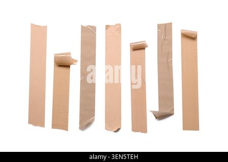 Brown adhesive tape strips with wrinkles and torn edges, packaging and repair materials, isolated on white background Stock Photo