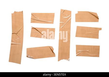 Brown adhesive tape pieces with wrinkles and creases, packaging and repair concept, isolated on white background Stock Photo