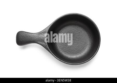 Empty black ceramic sauce dish with handle, top view, isolated on white background for culinary presentation Stock Photo