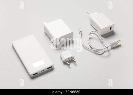 White portable power bank, USB wall chargers, and travel adapter for mobile device charging and electronic accessories Stock Photo