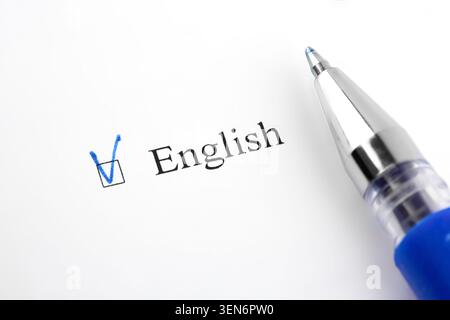 English. Filling in the questionnaire, documents. The checkboxes are filled with a black pen on a white background. Questionnaire, survey. Stock Photo