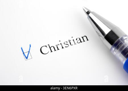 Christian. Filling in the questionnaire, documents. The checkboxes are filled with a black pen on a white background. Questionnaire, survey. Stock Photo