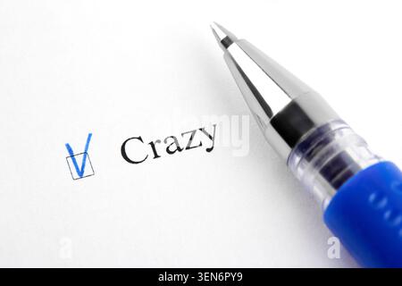 Crazy. Filling in the questionnaire, documents. The checkboxes are filled with a black pen on a white background. Questionnaire, survey. Stock Photo