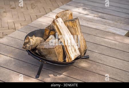 Stone fire pit in the backyard. Empty space for text. Stock Photo