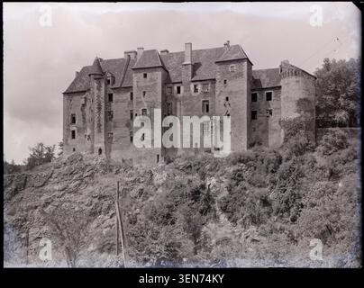 Château de Boussac appears in a 1950 photograph by Marcel Maillard. The image records the fortified castle at Boussac in the Creuse department of France and documents the historic structure identified in the source keywords. Stock Photo