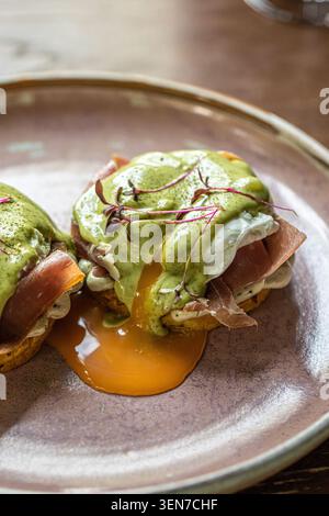 Gourmet eggs benedict with prosciutto Stock Photo