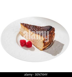 Basque burnt cheesecake with fresh raspberries Stock Photo