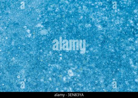 Abstract teal texture with mottled pattern and white speckles Stock Photo
