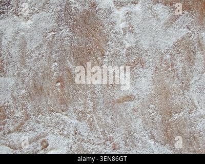 Old wooden board with flour. Background. Photo. Flour over wood. Rough wooden rectangular used cutting board background with flour Stock Photo