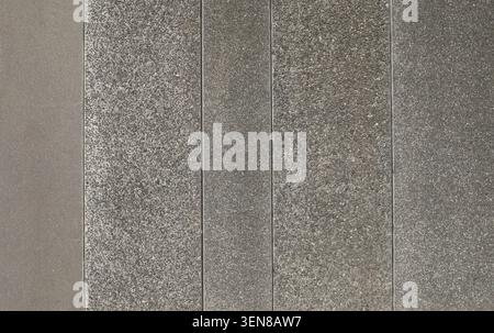 Assortment of gray exposed aggregate concrete blocks for walls or floors. Background and texture. Stock Photo