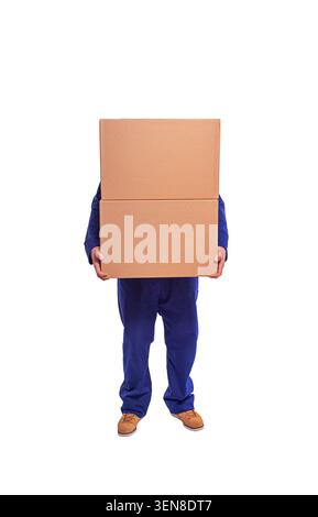 Worker in a blue uniform and red hard hat holds a blank cardboard sign against a white background. Stock Photo