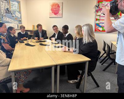 Esther Ghey (right) the mother of murdered teenager Brianna Ghey, joins the Duke of Westminster Hugh Grosvenor and Cheshire Police and Crime Commissioner Dan Price (fourth right) on a visit to Sir William Stanier school in Crewe, as it becomes one of the latest in Cheshire to introduce the signal-blocking pouches, which are locked after pupils place their phones into them at the start of the day. The mother of murdered teenager Brianna Ghey said it felt emotional to see "positive change" as she visited a school which has introduced lockable pouches to stop students using their phones during th Stock Photo