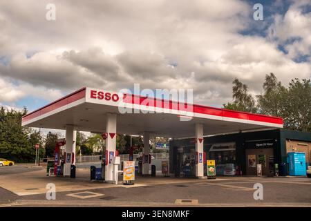 SURREY, UK- APRIL 17, 2026: DORKING – Esso petrol station with Morrisons Daily Stock Photo