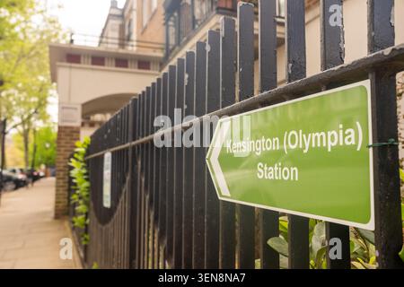 LONDON - APRIL 18, 2026: HAMMERSMITH – Kensington Olympia Station directional sign Stock Photo