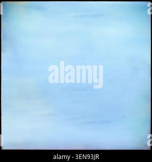 Photography mockup featuring a textured blue paper frame with distressed vintage edges and a blank central space for design or image insertion. Stock Photo