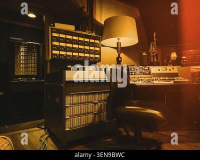 A large-format analog mixing console in a professional recording studio control room, USA. Stock Photo