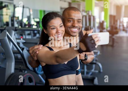Young black taking selfie together in gym after exercise Stock Photo