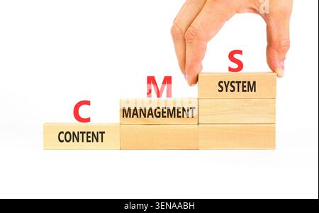 CMS content management system symbol. Concept words CMS content management system on beautiful wooden blocks. Beautiful white background. Business CMS Stock Photo