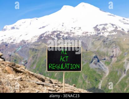 AI act regulation words symbol. Concept words AI artificial intelligence act regulation on beautiful black blackboard. Beautiful mountain background. Stock Photo