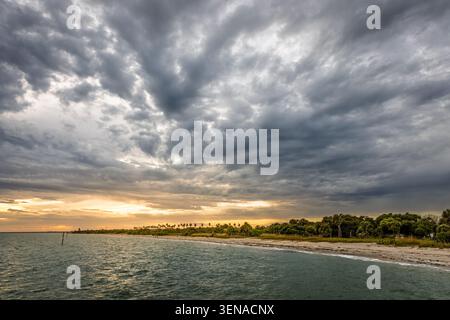 Scenic view of the beach at Fort DeSoto  Park in Florida under dramatic clouds Stock Photo