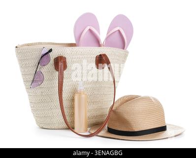 Knitted bag with beach accessories isolated on white Stock Photo