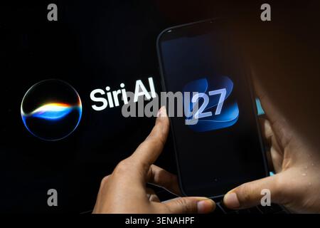June 10, 2026: In this photo illustration, a person holds an iPhone displaying the iOS 27 logo beside a screen showing Siri AI branding on June 10, 2026, in New Delhi, India. (Credit Image: © David Talukdar/ZUMA Press Wire) EDITORIAL USAGE ONLY! Not for Commercial USAGE! Stock Photo